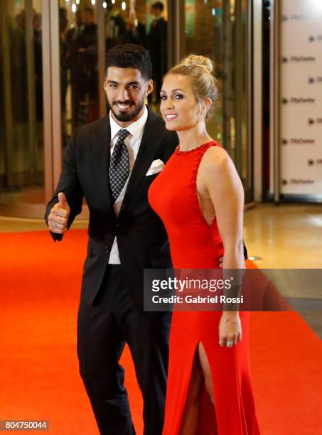 Uruguayan soccer player Luis Suarez and his wife Sofia Balbi pose for pictures on the red carpet during Lionel Messi and Antonela Rocuzzo's Wedding...