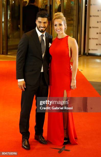 Uruguayan soccer player Luis Suarez and his wife Sofia Balbi pose for pictures on the red carpet during Lionel Messi and Antonela Rocuzzo's Wedding...