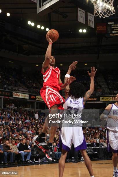 Tracy McGrady of the Houston Rockets shoots the ball over Mikki Moore of the Sacramento Kings on April 1, 2008 at ARCO Arena in Sacramento,...