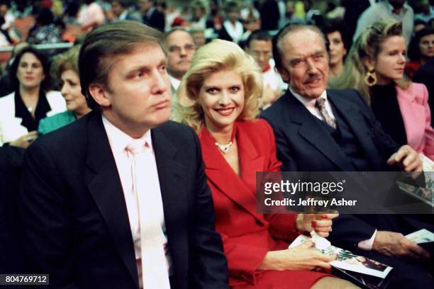 Businessman Donald Trump with first wife Ivana, and father Fred Trump ringside at Tyson vs Holmes Convention Hall in Atlantic City, New Jersey...