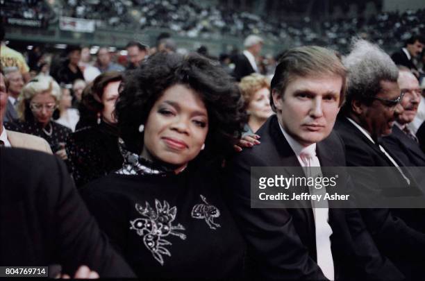 Businessman Donald Trump and Oprah Winfrey ringside at Tyson vs Spinks Convention Hall in Atlantic City, New Jersey June 27 1988.