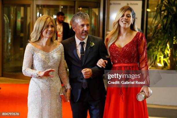 Celia Cuccittini Messi, Jorge Messi and Maria Sol Messi pose for pictures on the red carpet during Lionel Messi and Antonela Rocuzzo's Wedding at...