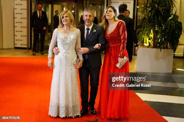 Celia Cuccittini Messi, Jorge Messi and Maria Sol Messi pose for pictures on the red carpet during Lionel Messi and Antonela Rocuzzo's Wedding at...
