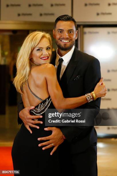Argentina soccer player Sergio Romero and his wife Eliana Guercio pose for pictures on the red carpet during Lionel Messi and Antonela Rocuzzo's...
