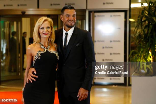 Argentina soccer player Sergio Romero and his wife Eliana Guercio pose for pictures on the red carpet during Lionel Messi and Antonela Rocuzzo's...