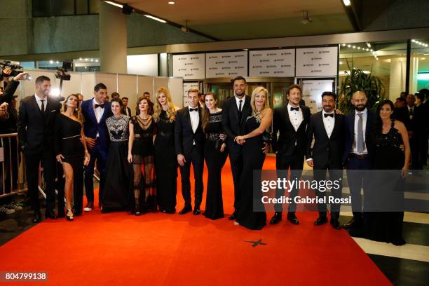 Mariano Andujar, Nahuel Guzman, Lucas Biglia, Sergio Romero, Ezequiel Lavezzi and Javier Mascherano pose for pictures on the red carpet along with...