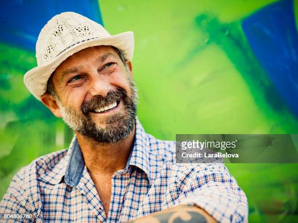 portrait of mature man, graffiti on background - funky person stock pictures, royalty-free photos & images