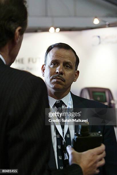 Jordanian Prince Faisal Bin al-Hussein , brother of King Abdullah II listens to a brief on an anti-chemical weapons tool displayed at the British...
