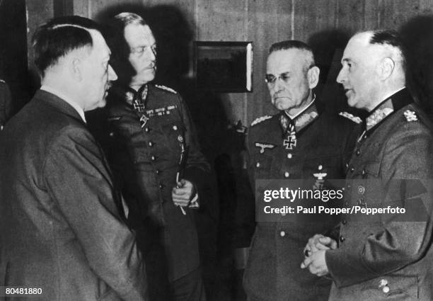 Nazi leader Adolf Hitler congratulates Commander-in-Chief of the Wehrmacht Heer, Walther von Brauchitsch on his 60th birthday, October 1941. Also...