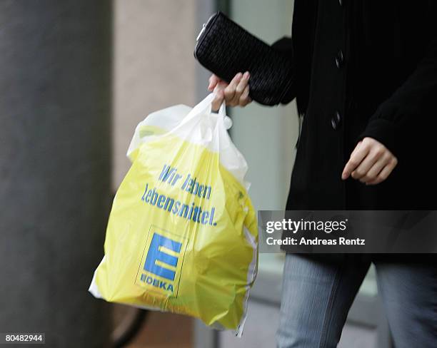 Shopper leaves a supermarket of German discount grocery chain Edeka on April 2, 2008 in Berlin, Germany. According to an investigation by the German...