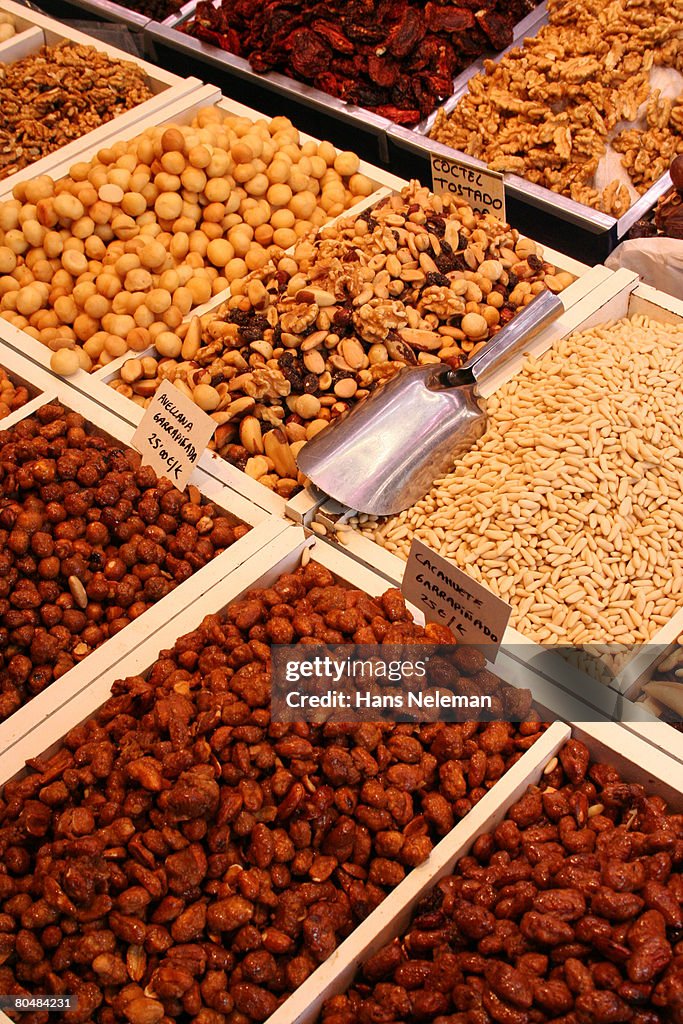 Dry fruits and nuts displayed in market, close-up