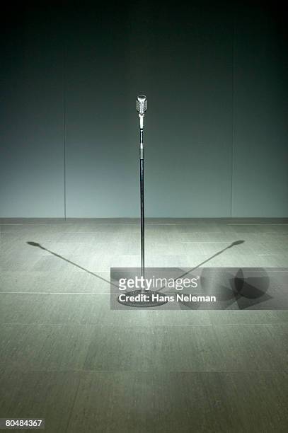 microphone on tiled floor, close-up - microphone stand stock pictures, royalty-free photos & images