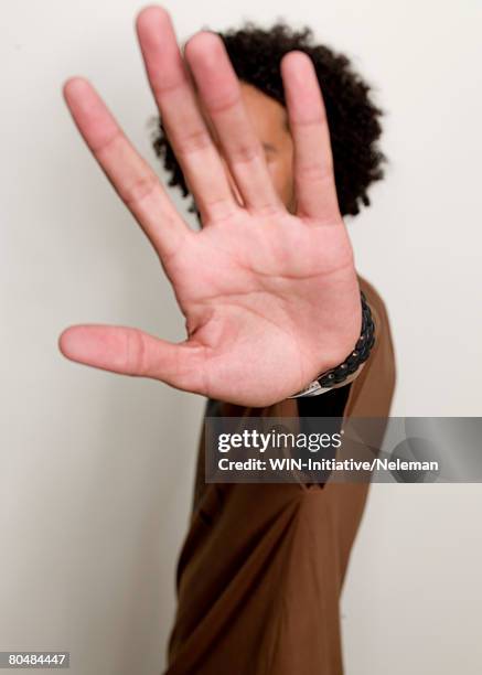 young man showing palm - maos abertas imagens e fotografias de stock