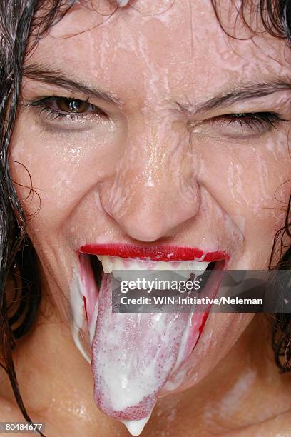 young woman sticking tongue, portrait - thick white women fotografías e imágenes de stock