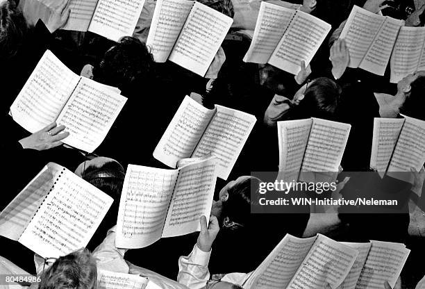 choir with notes in hands, overhead view - orquestra imagens e fotografias de stock