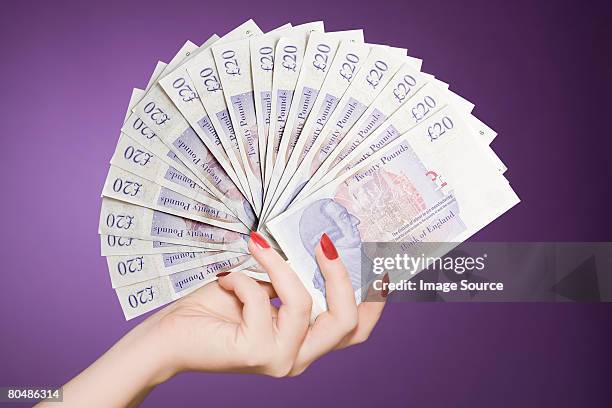 hand fan of banknotes - british pound note stock pictures, royalty-free photos & images