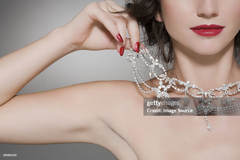 Woman trying on a diamond necklace