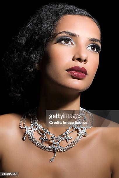 woman wearing a diamond necklace - diamond necklace stock pictures, royalty-free photos & images