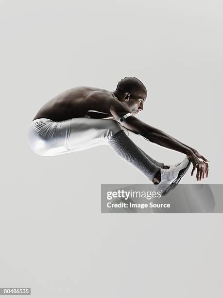 a long jumper - long jump stock pictures, royalty-free photos & images