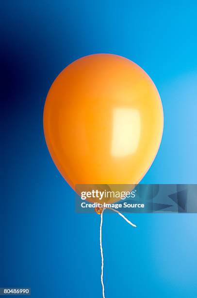 orange balloon - birthday balloons photos et images de collection