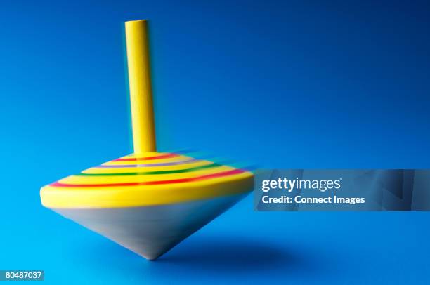 spinning top - spinning top stock pictures, royalty-free photos & images