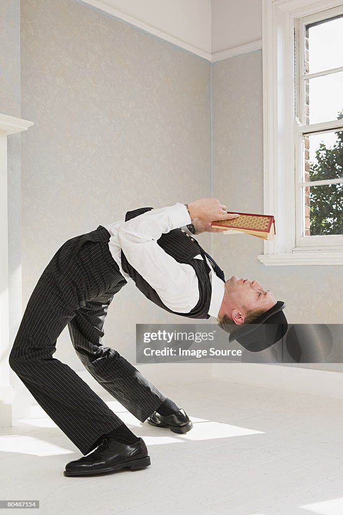 Contortionist reading a book