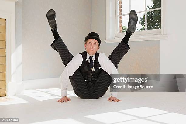 contortionist with legs raised - contortionist stock pictures, royalty-free photos & images