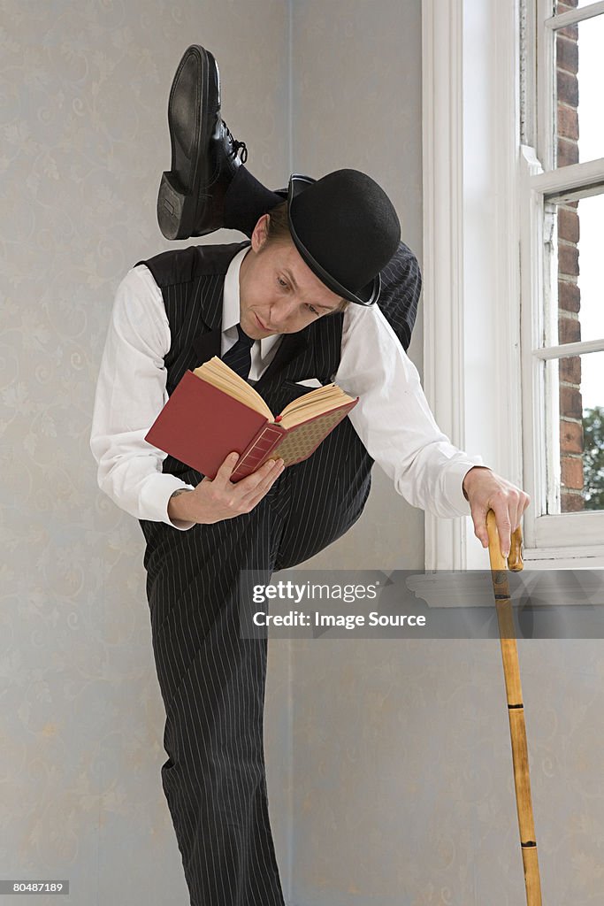 Contortionist Reading A Book High-Res Stock Photo - Getty Images