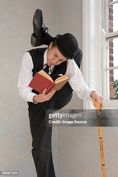 contortionist reading a book - double jointed stock pictures, royalty-free photos & images