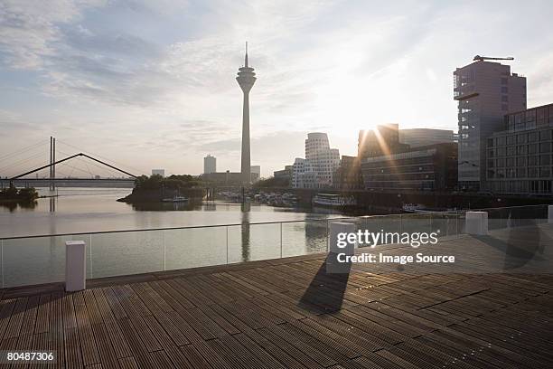 dusseldorf media harbour - communications tower sunset stock pictures, royalty-free photos & images