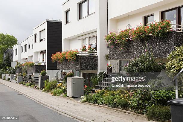 apartment buildings - suburban sidewalk stock pictures, royalty-free photos & images