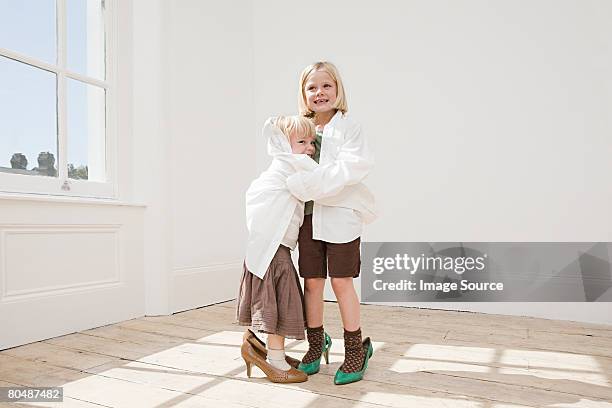 girls dressing up - tacones altos fotografías e imágenes de stock