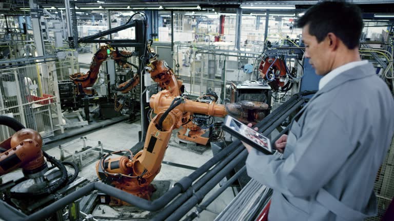 https://media.gettyimages.com/id/804875554/video/industrial-robots-work-process-being-supervised-by-an-asian-male-engineer.jpg?b=1&s=640x640&k=20&c=dqMMVSU_s2223xT6hsLSeVYWYgH5Stgubw5a4azeB-4=