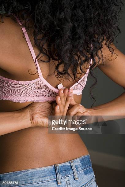 77 Young Woman Putting On Brarear View Stock Photos, High-Res