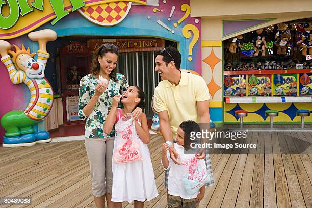 family at amusement park - fun house stock pictures, royalty-free photos & images