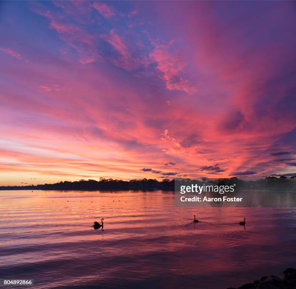 sunset over lake - imbrunire foto e immagini stock