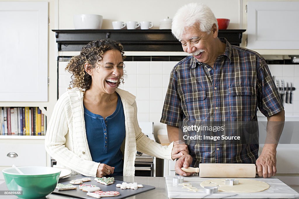 A father and daughter making cookies