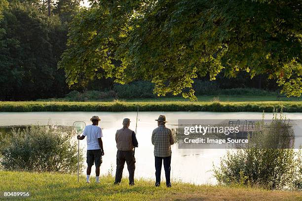 Anglers By Lake High-Res Stock Photo