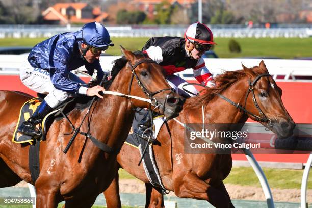 Damien Oliver riding Lone Eagle defeats Brandon Stockdale riding Evil Cry in Race1 during Melbourne Racing at Caulfield Racecourse on July 1, 2017 in...