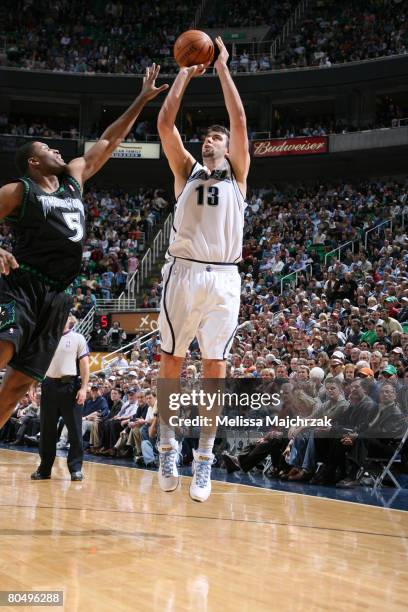 Mehmet Okur of the Utah Jazz shoots over Craig Smith of the Minnesota Timberwolves at EnergySolutions Arena on April 2, 2008 in Salt Lake City, Utah....