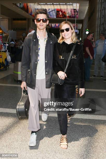 Brie Larson and Alex Greenwald are seen at LAX on June 30, 2017 in Los Angeles, California.