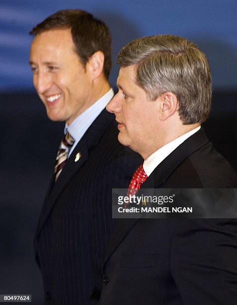 Canadian Prime Minister Stephen Harper and Defence Minister Peter MacKay arrive at the Parliament in Bucharest on April 3, 2008 to attend a formal...
