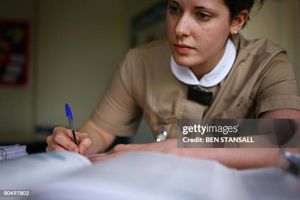 Stephanie Clark, a student at Norland College, is pictured at the college in Bath, in south-west England, March 13, 2008. Immaculately dressed,...