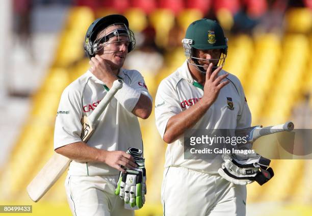 De Villiers and Jacques Kallis of South Africa leave the field with an unbroken partnership of a 100 runs during day one of the second test match...