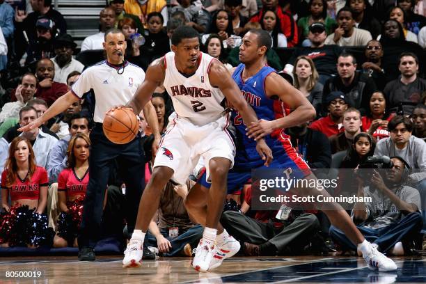 Joe Johnson of the Atlanta Hawks goes up against Arron Afflalo of the Detroit Pistons during the game on February 12, 2008 at Philips Arena in...