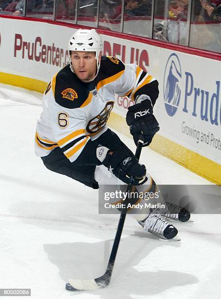 Dennis Wideman of the Boston Bruins skates with the puck against the New Jersey Devils during their game at the Prudential Center on April 2, 2008 in...