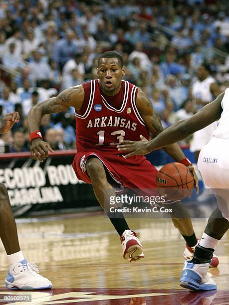 Sonny Weems of the Arkansas Razorbacks dribble drives the lane against the North Carolina Tar Heels during the 2nd round of the East Regional of the...