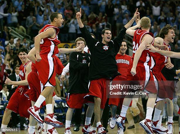 Stephen Curry of the Davidson Wildcats and teammates celebrate after defeating the Georgetown Hoyas during the 2nd round of the East Regional of the...