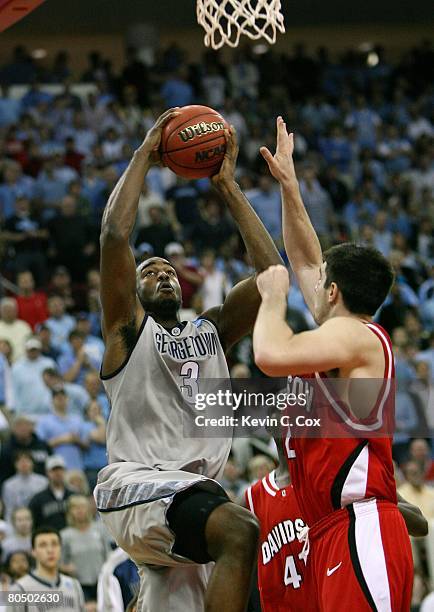 DaJuan Summers of the Georgetown Hoyas jumps to the basket for a shot against Jason Richards of the Davidson Wildcats during the 2nd round of the...