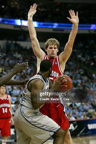 Thomas Sander of the Davidson Wildcats defends DaJuan Summers of the Georgetown Hoyas during the 2nd round of the 2008 NCAA Men's Basketball...